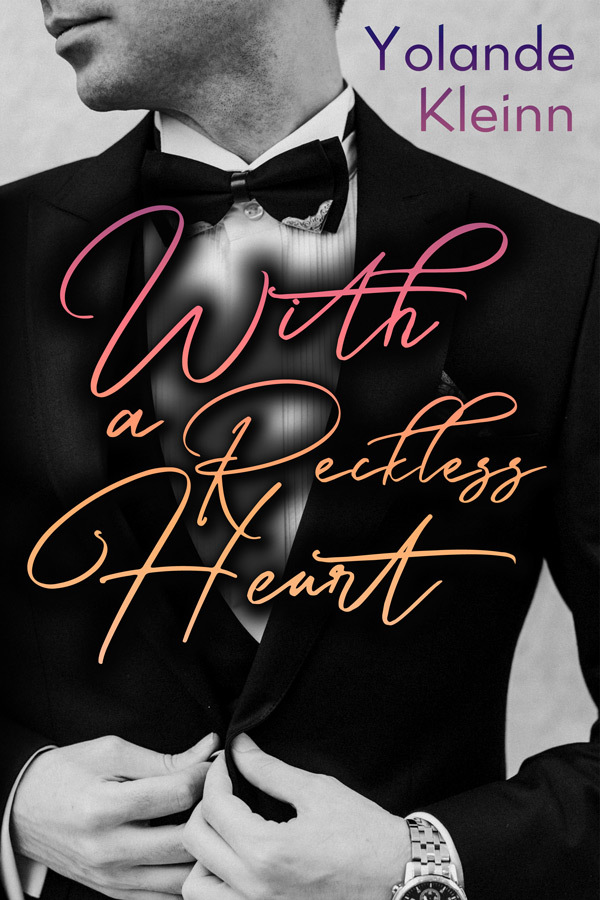 Book cover: With a Reckless Heart (Yolande Kleinn), a black and white photo of a dapper cleanshaven man in a tuxedo and bow tie, title is written in a cursive script overlaid with sunset colors 